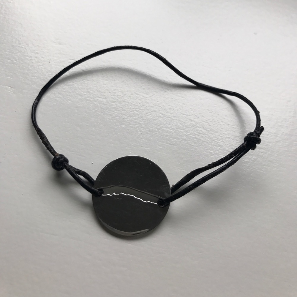 Black rope bracelet with silver disc
